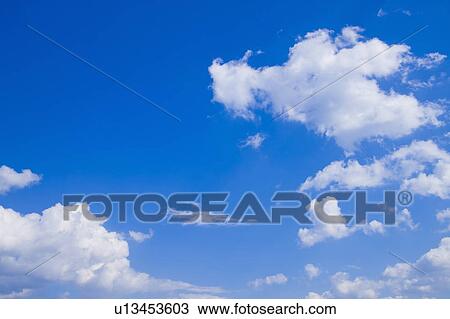 Stock Image - Clouds in blue sky. Fotosearch