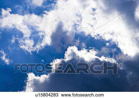 Stock Image - Clouds in blue sky. Fotosearch