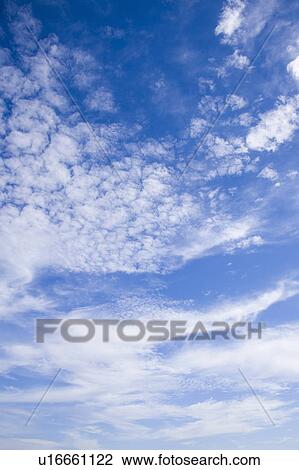 Stock Image - Clouds in blue sky. Fotosearch