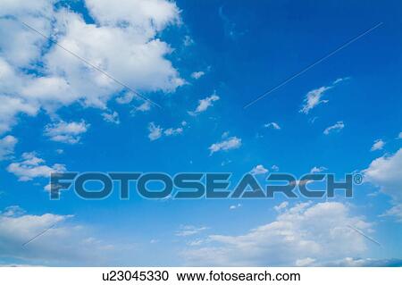 Stock Image - Clouds in blue sky. Fotosearch