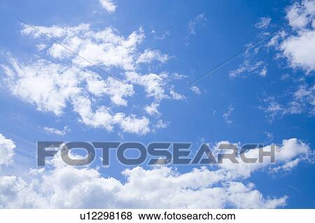 Stock Photo - Clouds in blue sky. Fotosearch