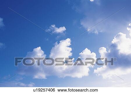 Clouds in blue sky View Large Photo Image Stock Photograph - Clouds in blue sky. Fotosearch