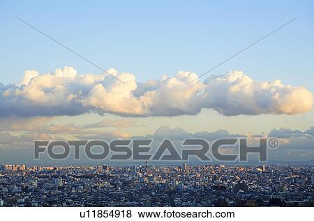 Stock Photo - Clouds over office buildings, Tokyo prefecture, Japan. Fotosearch