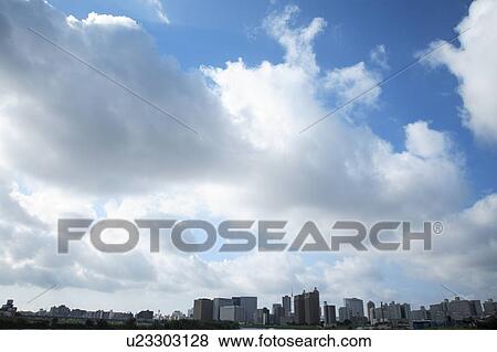 Clouds over office buildings, Tokyo prefecture, Japan View Large Photo Image Stock Photo - Clouds over office buildings, Tokyo prefecture, Japan. Fotosearch
