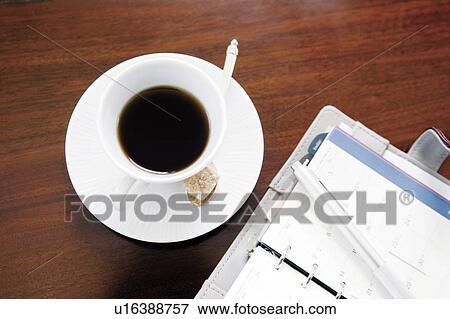 Coffee and a diary View Large Photo Image Stock Photo - Coffee and a diary. Fotosearch