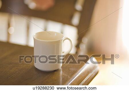 Coffee cup on table View Large Photo Image Stock Image - Coffee cup on table. Fotosearch