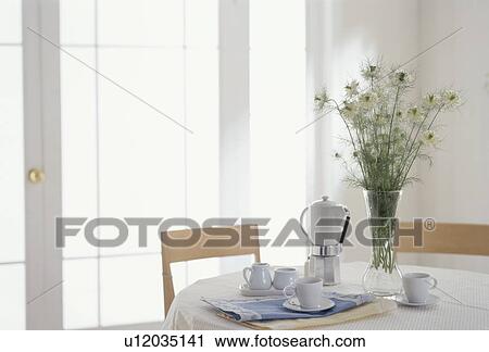 Coffee on table with white flowers View Large Photo Image Stock Image - Coffee on table with white flowers. Fotosearch