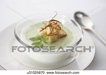 Stock Image - Cold asparagus soup with croutons. Fotosearch