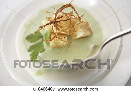 Stock Photo - Cold asparagus soup with croutons. Fotosearch