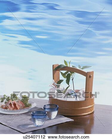 Cold sake served from an ice bucket View Large Photo Image Stock Image - Cold sake served from an ice bucket. Fotosearch