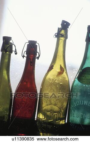 Colored Bottles on a Windowsill View Large Photo Image Stock Photography - Colored Bottles on a Windowsill. Fotosearch
