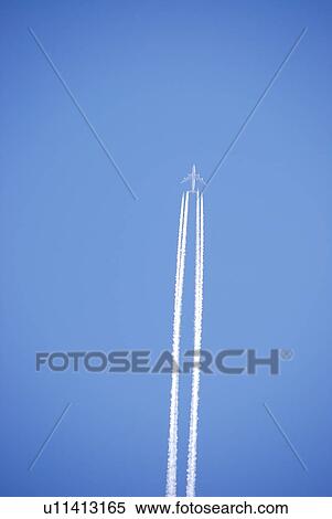 Stock Photography - Commercial airplane and contrail. Fotosearch