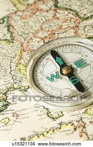 Picture - Compass on map. Fotosearch