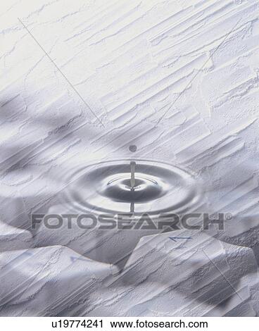 Stock Image - Composite image of a splash against a textured background of a keyboard. Fotosearch