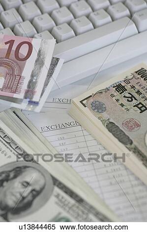 Computer keyboard and bundles of paper currencies View Large Photo Image Stock Photography - Computer keyboard and bundles of paper currencies . Fotosearch