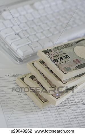 Computer keyboard and bundles of Japanese currencies View Large Photo Image Stock Image - Computer keyboard and bundles of Japanese currencies . Fotosearch