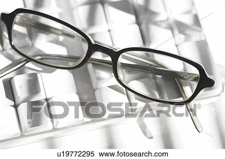 Computer keyboard and glasses View Large Photo Image Stock Photography - Computer keyboard and glasses. Fotosearch