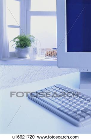 Stock Image - Computer on a white table. Fotosearch