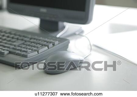 Stock Photo - Computer on desk. Fotosearch