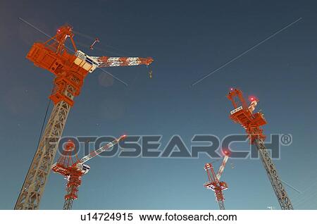 Stock Photography - Cranes on a construction site. Fotosearch