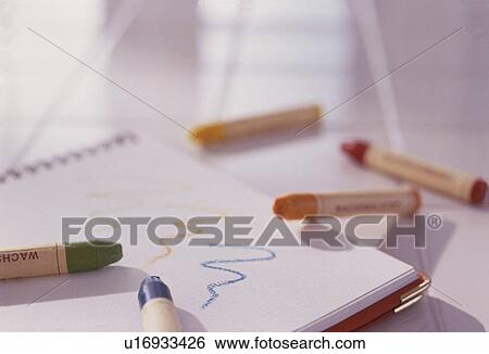 Crayons and a notepad View Large Photo Image Stock Photograph - Crayons and a notepad. Fotosearch