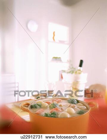 Stock Image - Creamy chowder in casserole dish. Fotosearch