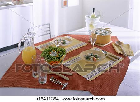 Picture - Creamy stew and salad on dining table. Fotosearch