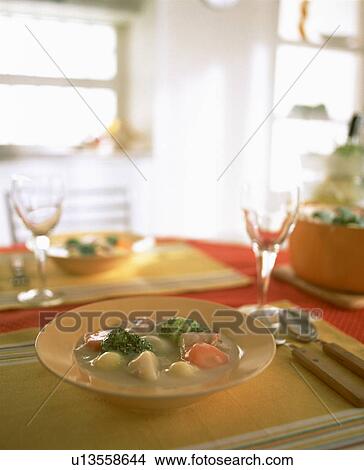 Picture - Creamy stew on table with wineglasses. Fotosearch