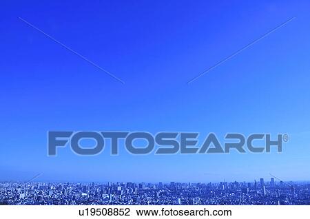 Stock Image - Crowded Buildings and Blue Sky. Fotosearch