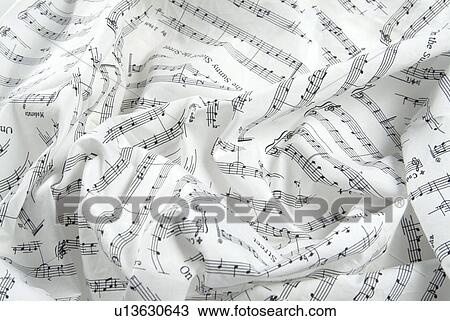 Stock Image - Crumpled sheet music, close up, full frame. Fotosearch