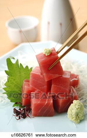 Stock Image - Cubes of raw tuna on plate. Fotosearch