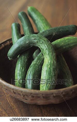 Stock Photo - Cucumbers in a bamboo basket. Fotosearch