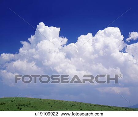 Cumulonimbus clouds over field, Biei town, Hokkaido prefecture, Japan View Large Photo Image Stock Image - Cumulonimbus clouds over field, Biei town, Hokkaido prefecture, Japan. Fotosearch