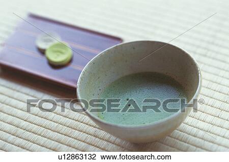 Cup of Japanese tea and plate of shi on Tatami mat, close up View Large Photo Image Stock Image - Cup of Japanese tea and plate of shi on Tatami mat, close up. Fotosearch