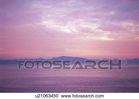 Stock Image - Dawn sky reflected on the sea. Kanagawa Prefecture, Japan. Fotosearch