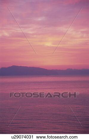 Stock Image - Dawn sky reflected on the sea. Kanagawa Prefecture, Japan. Fotosearch