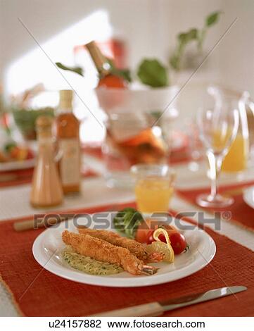 Stock Image - Deep fried crumbed prawn dish. Fotosearch