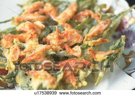 Stock Photo - Deep fried shrimp and tea leaves, close up. Fotosearch