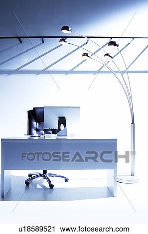 Stock Image - Desk in office, white background. Fotosearch