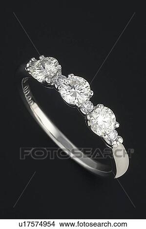 Picture - Diamond ring, black background. Fotosearch