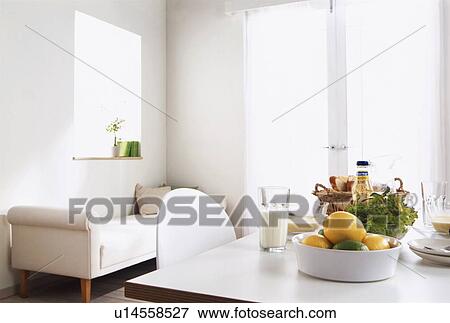 Stock Photo - Dining room with food arranged on table. Fotosearch