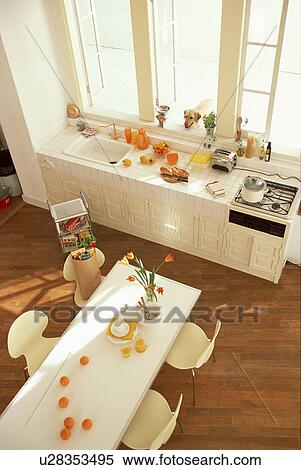 Stock Photography - Dining table and kitchen counter. Fotosearch