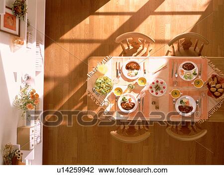 Dining table with four meals View Large Photo Image Stock Image - Dining table with four meals. Fotosearch