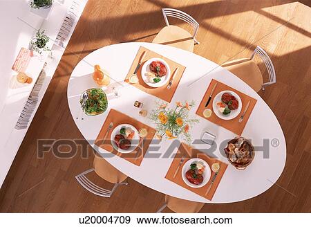 Dining table with four meals View Large Photo Image Stock Photo - Dining table with four meals. Fotosearch