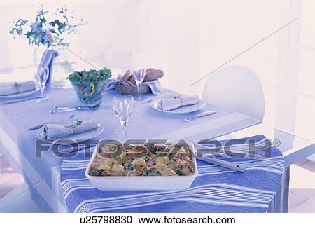 Dining table with gratin dish View Large Photo Image Stock Image - Dining table with gratin dish. Fotosearch