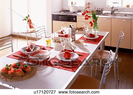 Stock Photo - Dining table with meal for four. Fotosearch