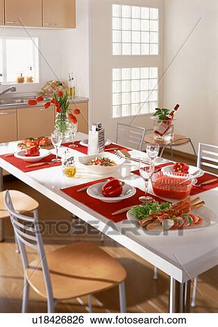 Dining table with meal for four View Large Photo Image Stock Photograph - Dining table with meal for four. Fotosearch