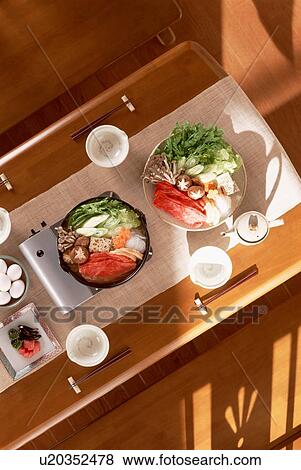 Dining table with steamboat dishes View Large Photo Image Stock Photo - Dining table with steamboat dishes. Fotosearch