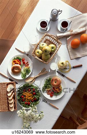 Stock Photo - Dining table with two meals and coffee. Fotosearch