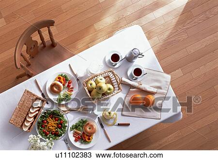 Stock Image - Dining table with two meals. Fotosearch